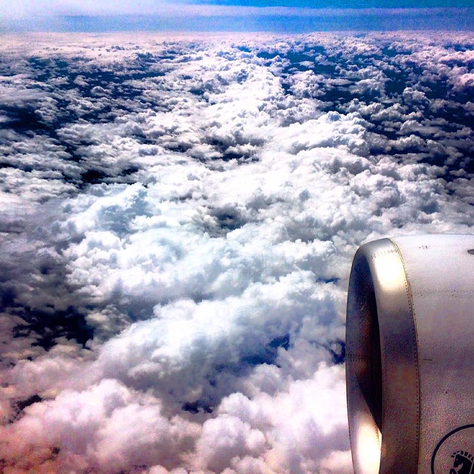 Manchester to Paris flight plane above clouds