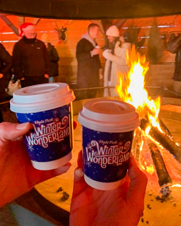 Mulled wine in front of fire at Winter Wonderland