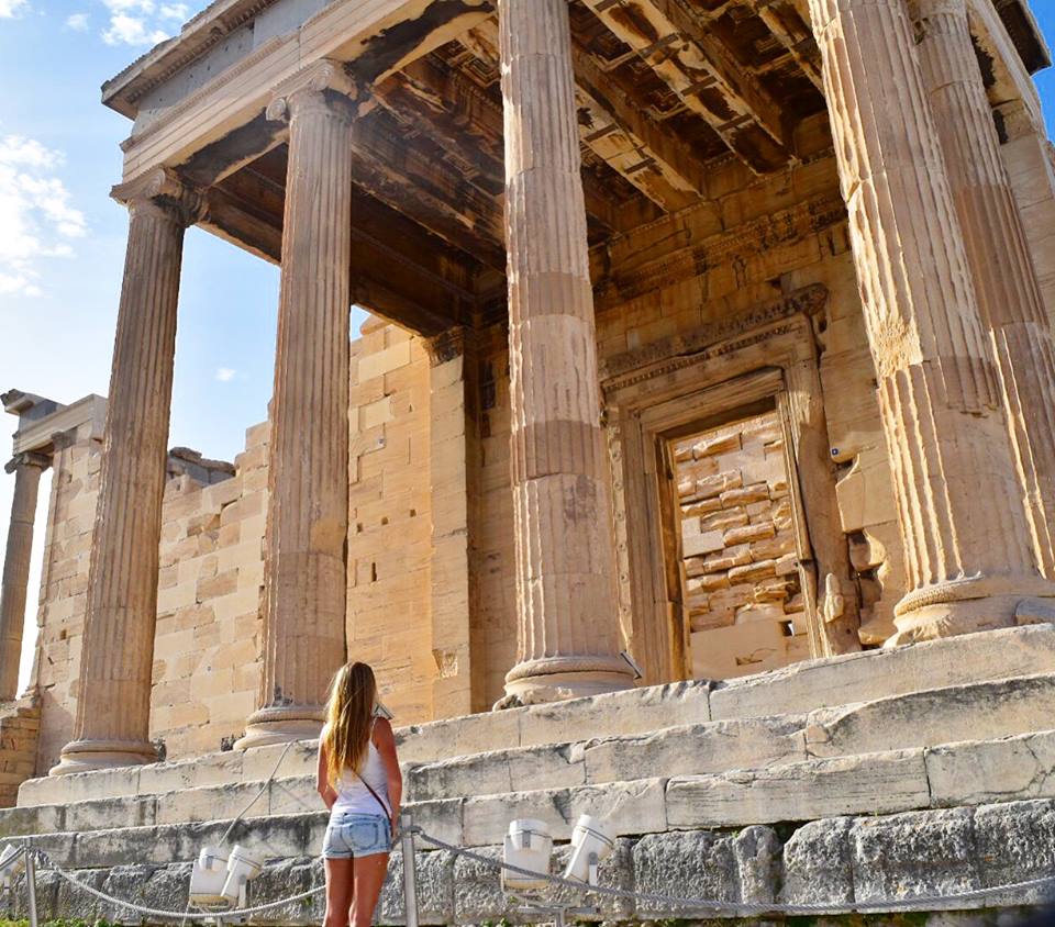 Girl standing in front of ruins in Athens Greece