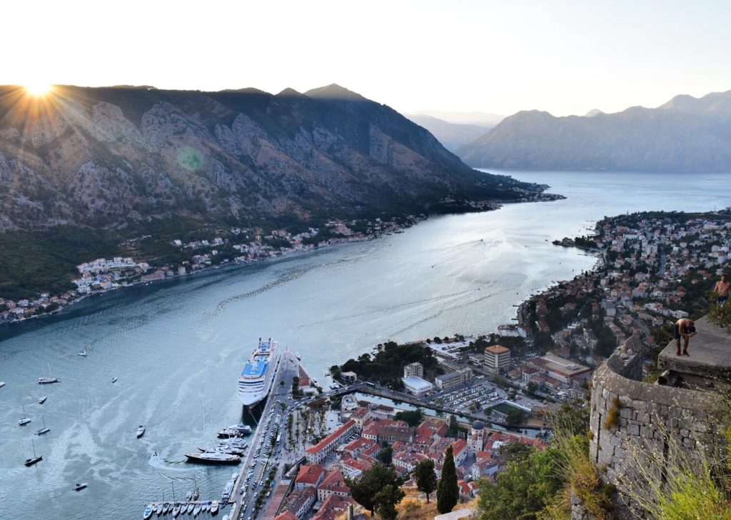 Looking at mountains, lake and old town of Kotor from the Kotor Fortress at Sunset bucket list destinations