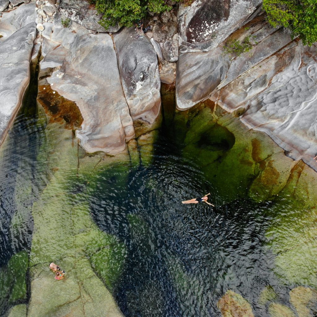 Girl floating in Behana Gorge in Cairns