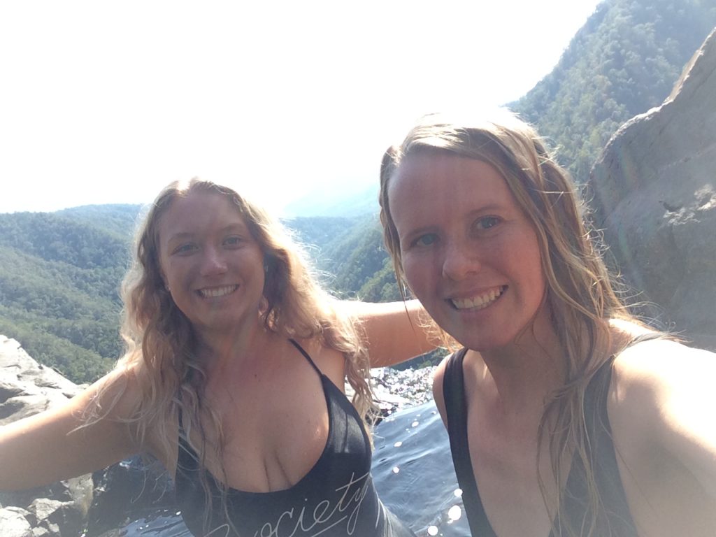 Two girls taking a selfie at the top of Windin Falls waterfall