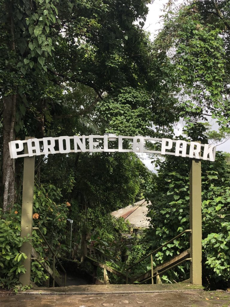 Sign over footpath in rainforest reaiding Paronella Park