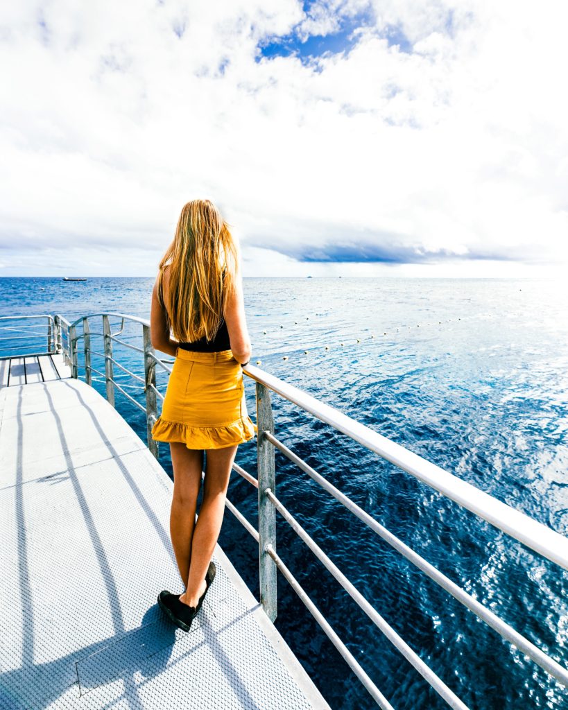 Sarah Latham standing on Quicksilver pontoon in Great Barrier Reef