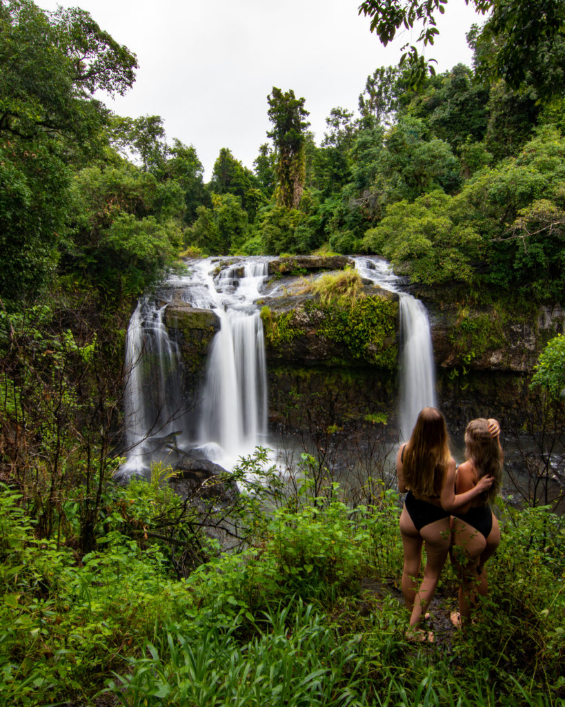 two girls in front of Tchupala Falls Cairns Atherton Tablelands waterfalls